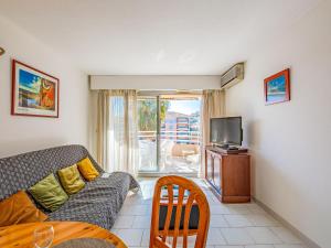 Televízia a/alebo spoločenská miestnosť v ubytovaní Apartment Port d'Attache-10 by Interhome + 16 fotografií