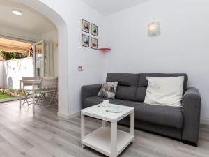 a living room with a couch and a table at Villa Villa Casalot 9 by Interhome in Miami Platja +15 photos