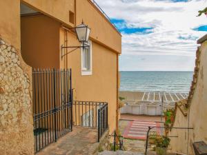 a building with a view of the beach at Apartment Sul mare by Interhome in Vendicio