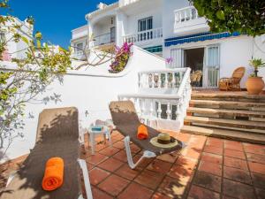 A balcony or terrace at Holiday Home Jardines de Nerja by Interhome