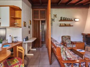 a living room with a couch and a table at Chalet Lucia by Interhome in Claino