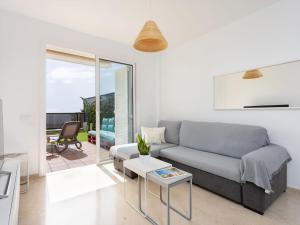 A seating area at Apartment Playa Negra II by Interhome