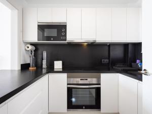 A kitchen or kitchenette at Apartment Playa Negra II by Interhome