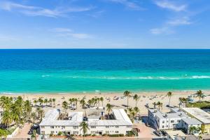 an aerial view of a beach with palm trees and buildings at Casa Pellegrino Boutique Hotel in Hollywood