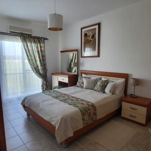 a bedroom with a large bed and a window at SUMMER TERRACE 26 in Kalecik +56 photos