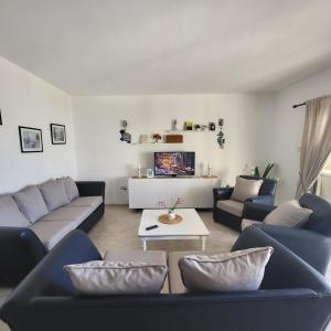 a living room with couches and a coffee table at SUMMER TERRACE 26 in Kalecik