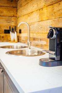 a kitchen counter with a sink and a toaster at The Granary in Canterbury