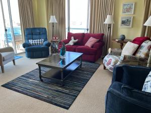 a living room with couches and a coffee table at Miramar Condominiums in Ocean City