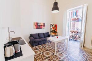 a living room with a couch and a table at Daniel's Apartment in Bari
