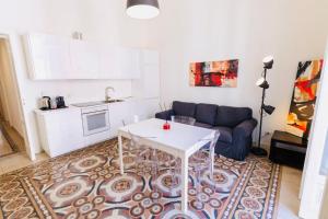 a living room with a couch and a table at Daniel's Apartment in Bari