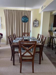 a dining room table and chairs in a room at Miramar Condominiums in Ocean City