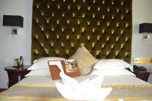 A bed or beds in a room at Staybridge Riverside Hotel & Spa