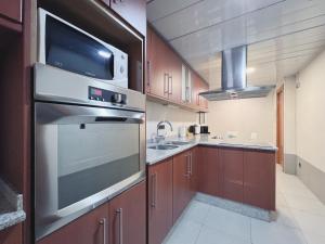 Kuchyň nebo kuchyňský kout v ubytování Stay U-nique Apartments Diagonal
