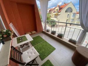 a balcony with a table and a view of a building at Lovely 1-bedroom apartament with free parking in Sofia