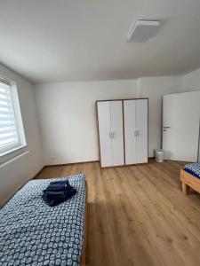 Ein Bett oder Betten in einem Zimmer der Unterkunft S&D