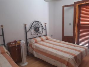 A bed or beds in a room at Sol-Paraíso