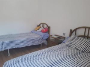 A bed or beds in a room at Sol-Paraíso