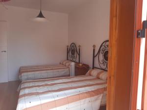 A bed or beds in a room at Sol-Paraíso