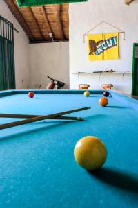 a pool table with cue balls on top of it at La Hacienda in San Gil