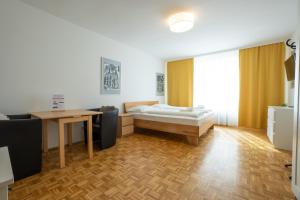 Łóżko lub łóżka w pokoju w obiekcie Central living - Stephansdom Apartments