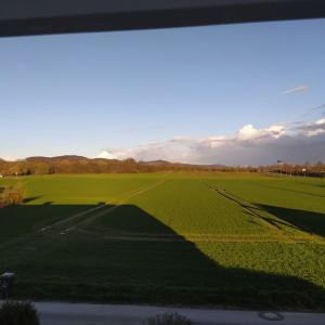 a view of a field of grass with a road at Apartment Düte in Erpen