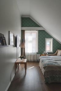 Postel nebo postele na pokoji v ubytování Grand Hotel Egersund