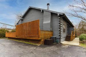 a small house with a wooden fence in front of it at 3 Bedroom Log Cabin Condo close to Everything! in Branson