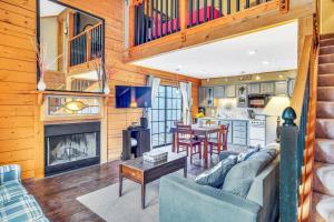 a living room with a couch and a fireplace at 3 Bedroom Log Cabin Condo close to Everything! in Branson