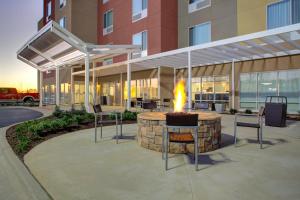 a fire pit in the middle of a building at TownePlace Suites by Marriott Albany in Albany