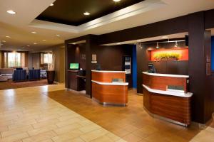 a lobby with a waiting area in a hotel at Courtyard by Marriott Brownsville in Brownsville