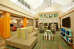 a living room with a couch and a tv at Residence Inn Bridgewater Branchburg in Branchburg Park