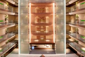 a hallway in a building with glass walls at Madrid Marriott Auditorium Hotel & Conference Center in Madrid