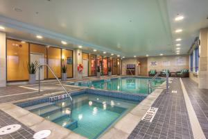 a large swimming pool in a hotel room at TownePlace Suites by Marriott Belleville in Belleville