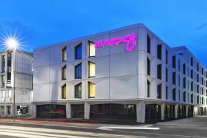 a building with a sign on the side of it at Moxy Lausanne City in Lausanne