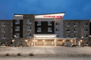 a rendering of the front of a hotel with a parking lot at TownePlace Suites by Marriott Oshkosh in Oshkosh