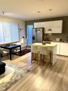 a kitchen and dining room with a table and chairs at Cosy one bedroom apartment in Reykjavík in Reykjavík