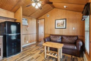 a living room with a couch and a table at Camp Cardinal in Broad Marsh