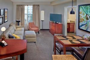 a living room with a couch and a table at Residence Inn Orlando Lake Mary in Lake Mary