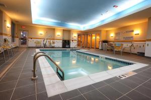 a large swimming pool in a hotel room at Fairfield Inn & Suites by Marriott Madison Verona in Verona