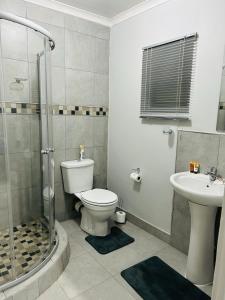Koupelna v ubytování Reros Apartments in Mankweng