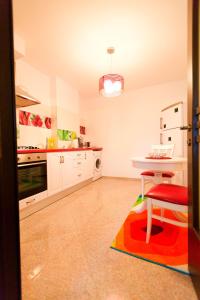 a kitchen with a table and a chair in it at Noblesse Suite in Galaţi