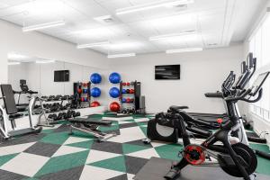 a gym with treadmills and exercise bikes in a room at Element Nashville Airport in Nashville