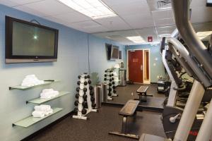 a gym with tread machines and a flat screen tv at Fairfield Inn & Suites by Marriott Somerset in Somerset