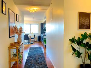 a hallway with a living room and a dining room at Top floor city center flat with free parking in Oslo