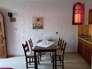 a dining room table and chairs in a kitchen at Stella Apartments Malia in Malia