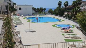 Bazén v ubytování Residencial Sol Suite 2 nebo v jeho okolí