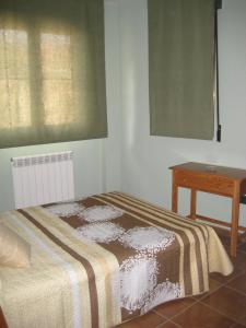 Postel nebo postele na pokoji v ubytování Hostal Guarni