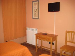 TV a/nebo společenská místnost v ubytování Hostal Guarni