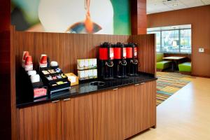 a bar in a restaurant with wine bottles at Fairfield by Marriott Inn & Suites Wheeling at The Highlands in Triadelphia