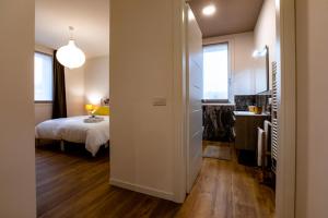 Postel nebo postele na pokoji v ubytování B&B Quattro Stagioni Charme and Wellness